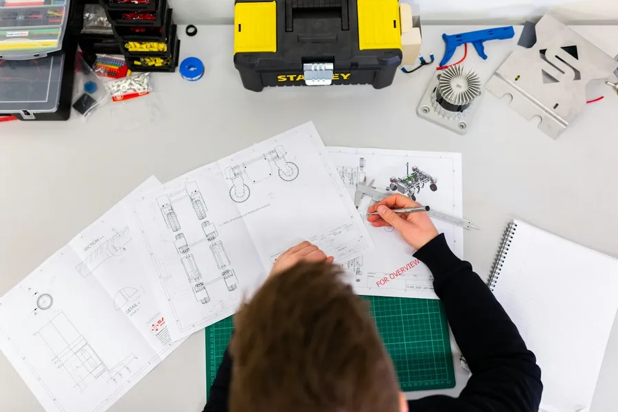 Engineers reviewing technical drawings